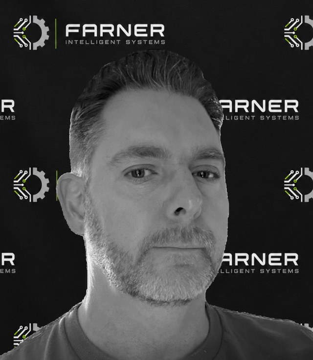 Black-and-white portrait of Sean Farner in front of a backdrop of the Farner Intelligent Systems logo.
